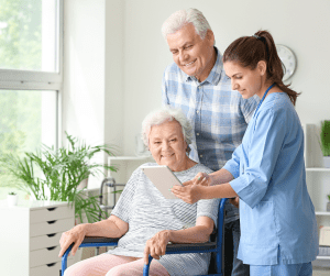 Nurse talking with couple in home, Pemi-Baker Hospice & Home Health, Plymouth, NH 